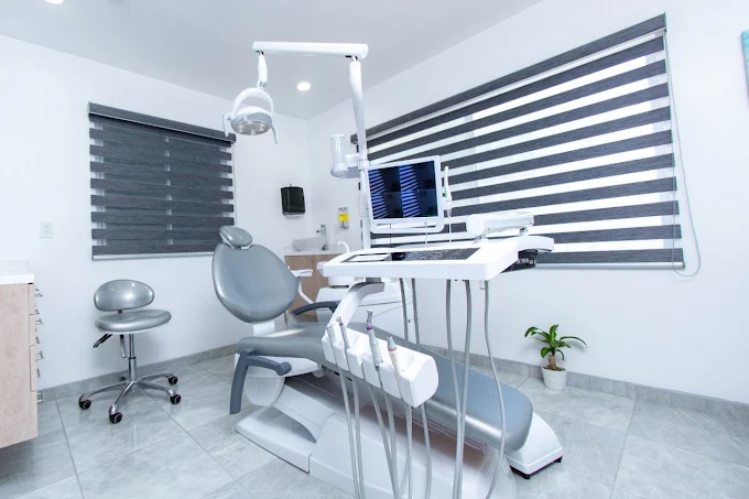 Full view of the ALDental treatment room with dental chair, light and windows